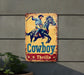 a cowboy riding a horse on a yellow and red sign