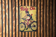 a sign on a wooden wall that says ride on