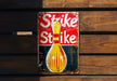 a sign that says strike strike strike