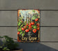 a sign that says city grow with tomatoes on it