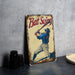 a metal sign with a baseball player holding a bat