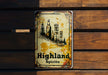a sign on a wooden wall that says highland spirits