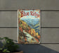 a blue ridge sign hanging on the side of a building
