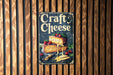 a sign on a wooden wall that says craft cheese