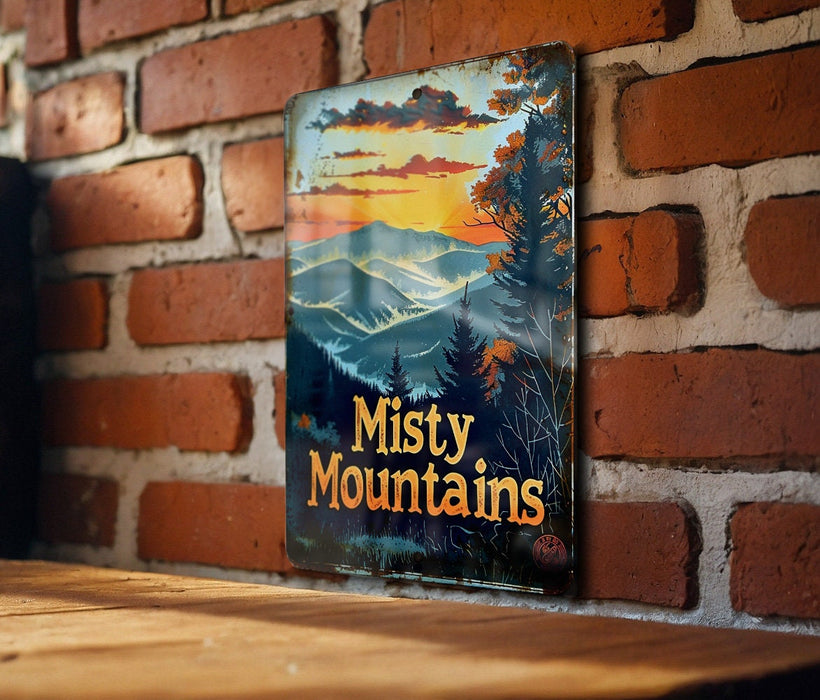a sign on a brick wall that says misty mountains