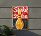 a sign on the side of a building that says strike strike
