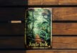 a jungle trek sign hanging on a wooden wall