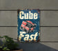 a sign that says cube fast on a wall