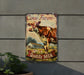 a cow farm sign hanging on the side of a building