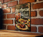 a picture of a barbeque sign on a brick wall