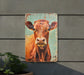 a picture of a cow on a wall