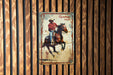 a picture of a cowboy riding a horse