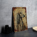 a painting of a long haired dog on a wooden plaque