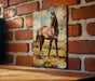 a picture of a horse on a brick wall