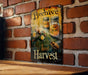 a picture of a beehive sign on a brick wall