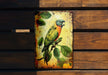 a colorful bird sitting on top of a wooden bench