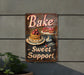 a sign on the side of a building that says bake sweet support