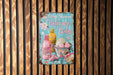 a baby shower sign hanging on a wooden wall