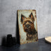 a picture of a dog on a rusty metal sign