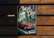 a book about classic cars on a wooden bench