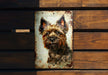 a picture of a dog on a metal plaque