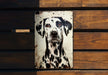 a picture of a dalmatian dog on a sign