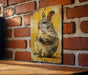 a picture of a rabbit on a brick wall