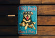 a dog park sign on a wooden bench