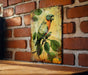 a painting of a parrot on a brick wall