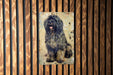 a picture of a dog on a wooden wall
