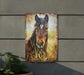 a picture of a horse is hanging on a wall