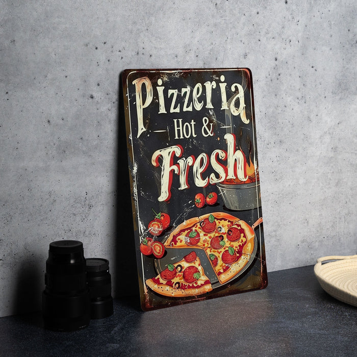 a pizza sign sitting on top of a table