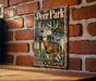 a deer park sign mounted on a brick wall