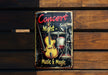 a metal sign on a wooden wall that says concert night music and magic