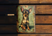 a picture of a small dog is hanging on a wooden wall