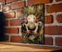 a picture of a frog on a brick wall