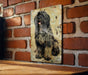 a painting of a dog on a brick wall