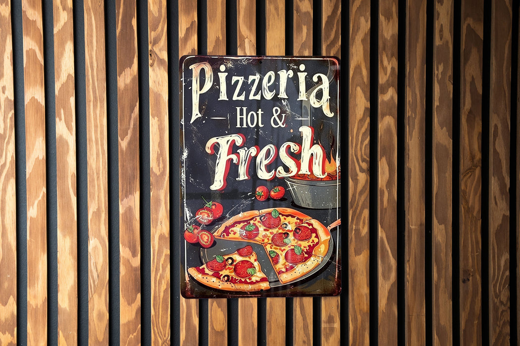 a pizza sign hanging on a wooden wall