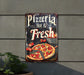 a sign advertising a pizza restaurant on the side of a building