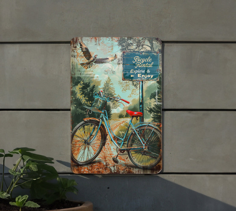 a metal sign with a bicycle painted on it