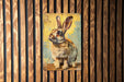 a painting of a rabbit on a wooden wall