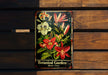 a picture of a botanical garden sign hanging on a wooden wall
