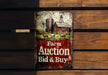a farm auction sign on a wooden bench
