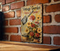 a vintage garden sign on a brick wall
