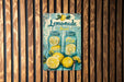 a picture of a lemonade sign hanging on a wall