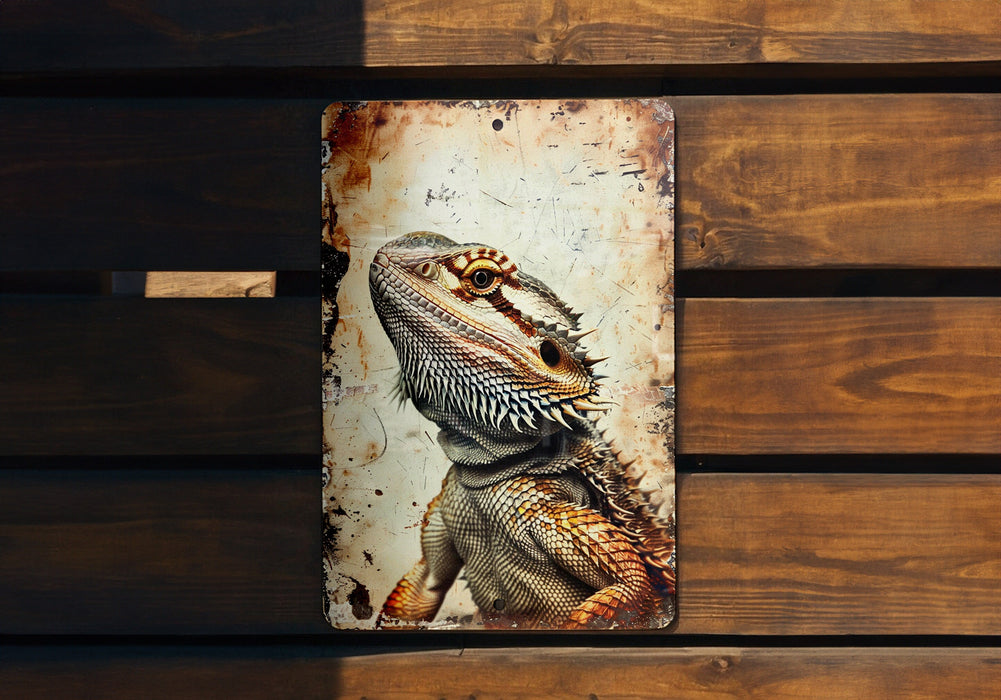 a picture of a lizard on a rusted metal sign