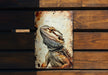 a picture of a lizard on a rusted metal sign