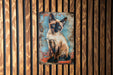 a picture of a siamese cat on a wooden wall