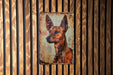 a painting of a dog on a wooden wall