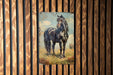 a painting of a black horse on a wooden wall